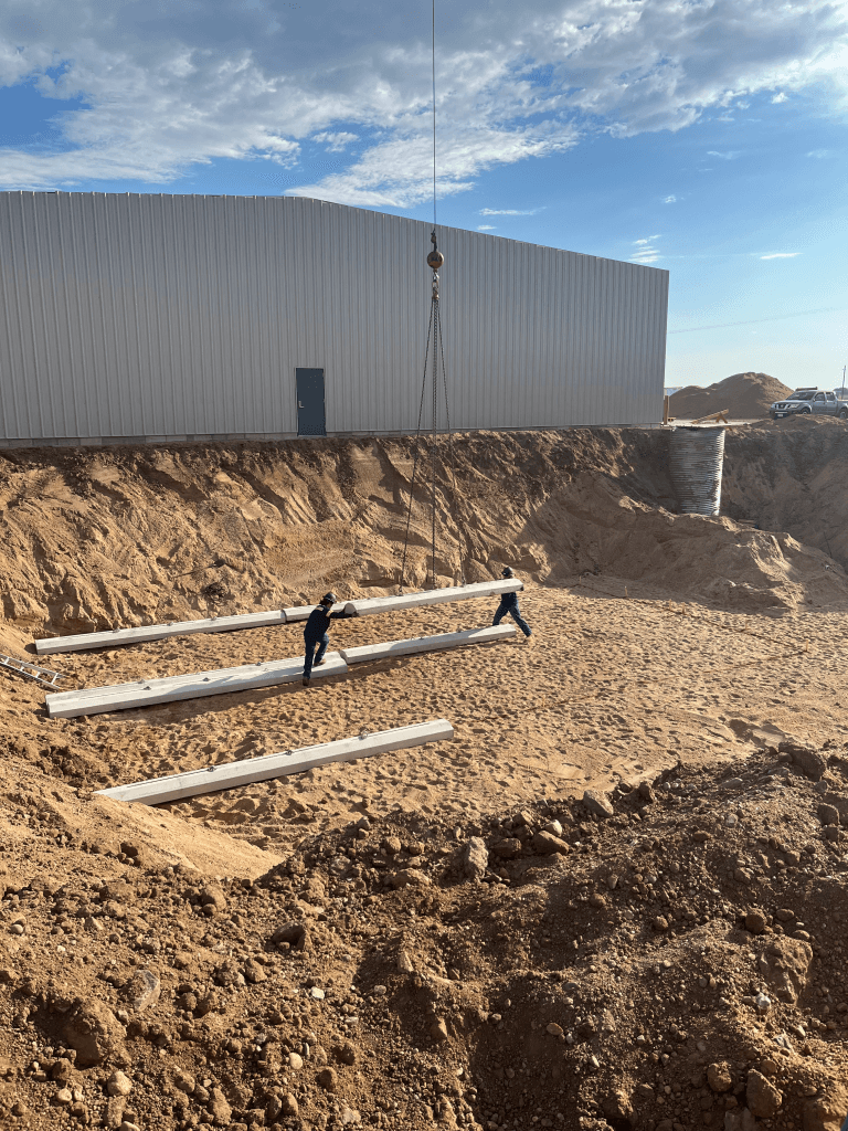 Placing Deadman into Excavated Hole