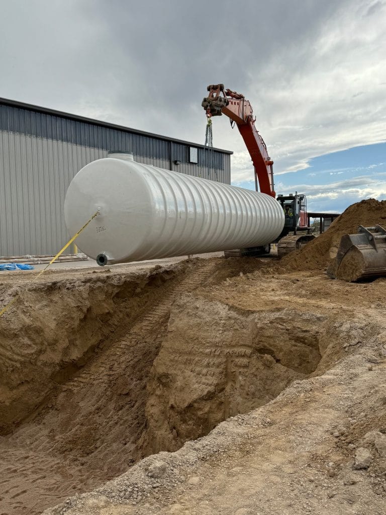 Excavator Carrying Fiberglass UST