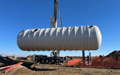 Lifting an AFFF FRP Tank with a crane into excavation